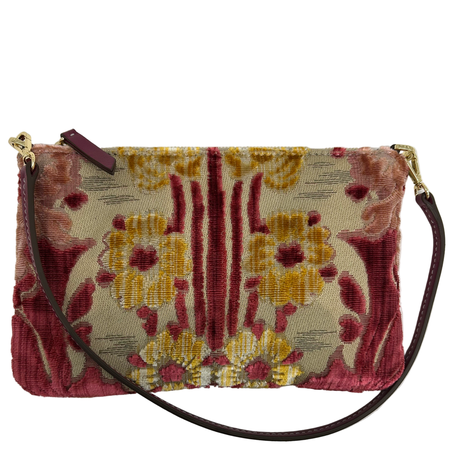 Floral patterned handbag with a strap on a light gray background