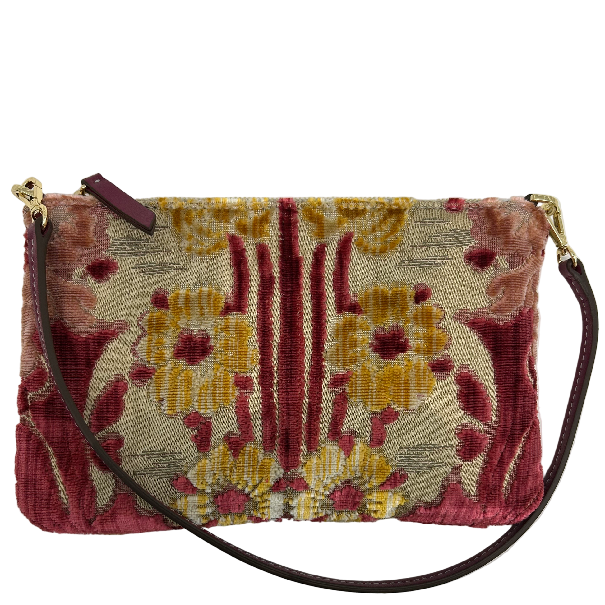 Floral patterned handbag with a strap on a light gray background