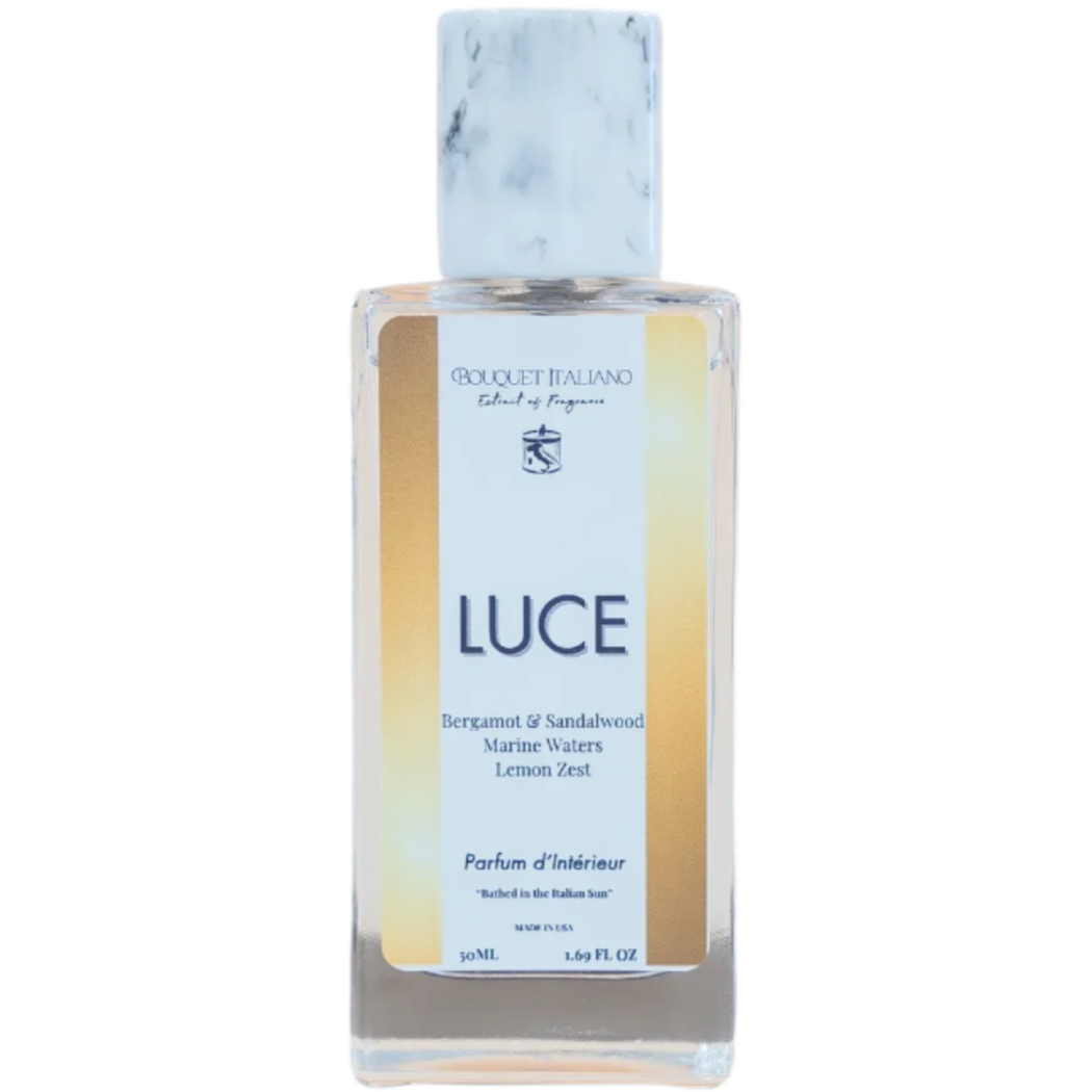 Perfume bottle labeled 'Luce' on a light gray background