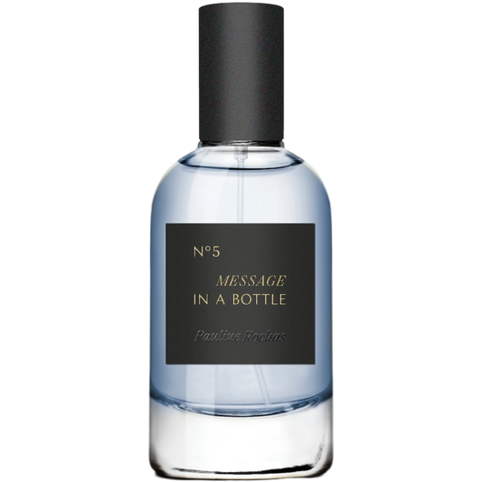 Perfume bottle labeled 'Message in a Bottle' by Pauline Reiffel on a white background
