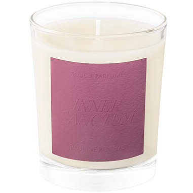 Candle with a purple label on a white background