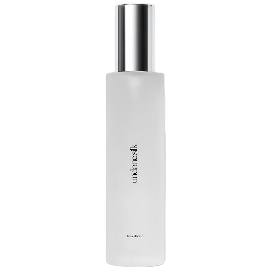 White undone silk body oil bottle from the brand skin