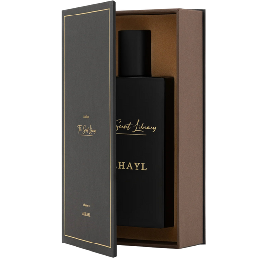 Black bottle with 'The scent Library' branding in a wooden box on a white background