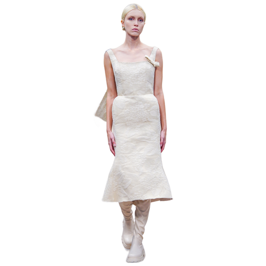 White dress worn by a model on a white background